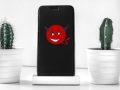 Teufel-Smiley auf Handy-Display